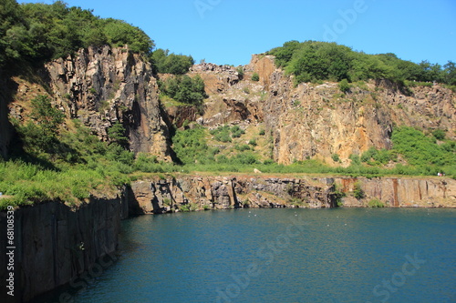 Lake with cliffs and blue sky