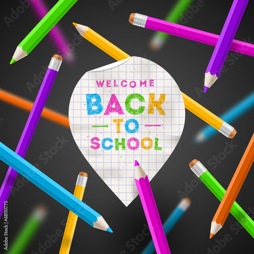 Back to school - paper map poiner with greeting and pencils photo