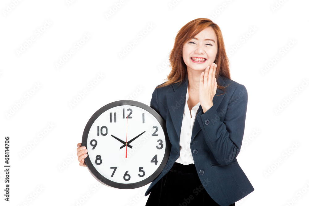 Happy Asian businesswoman laughing with a clock Happy Asian businesswoman laughing with a clock
