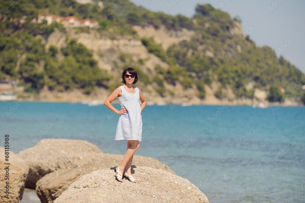 Woman on Stone in sea