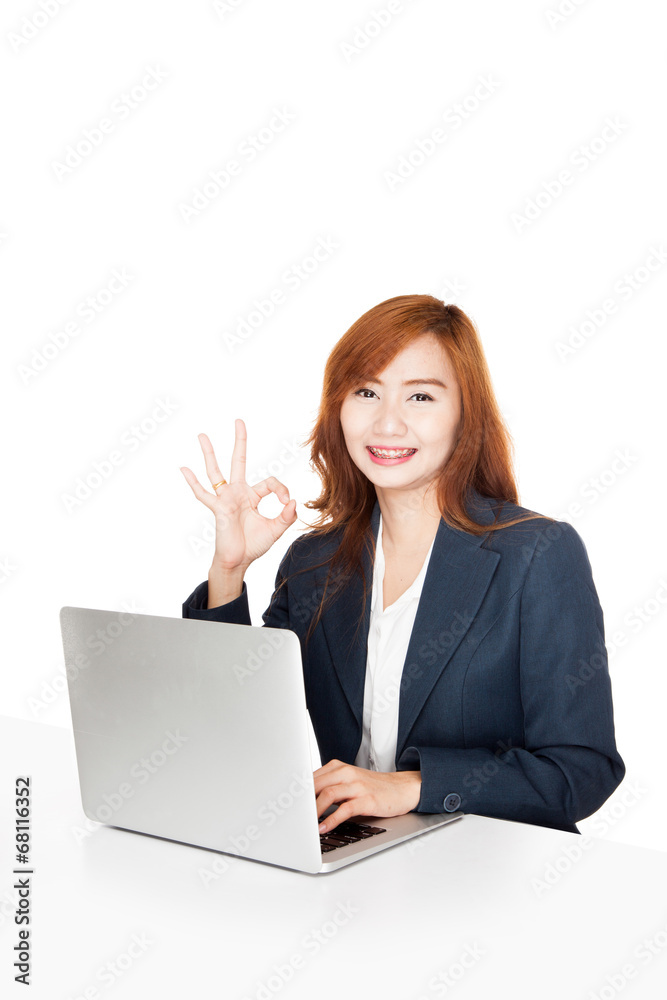 Asian office girl show OK sign with notebook PC Asian office girl show OK sign with notebook PC