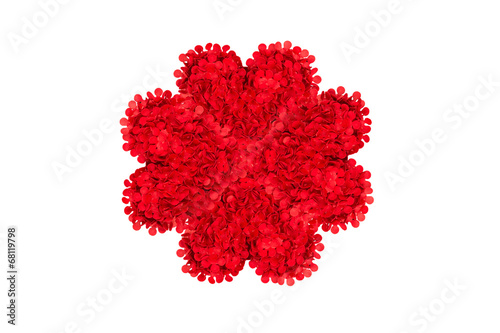 Paper flower with red petals on white background