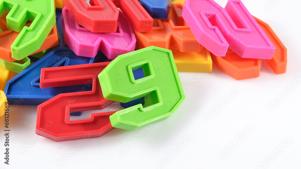 Colorful plastic numbers on a white