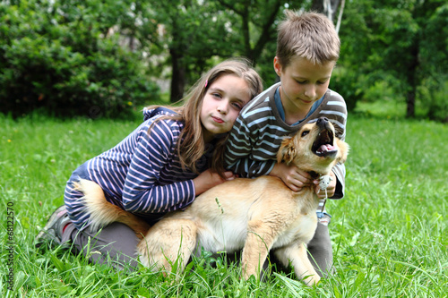 brother and sister and their dog