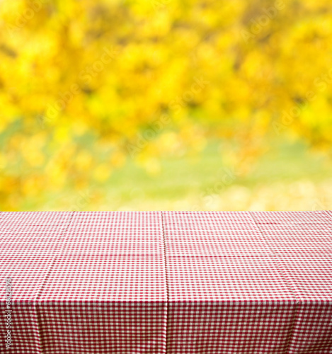 autumn background with red checkered tablecloth