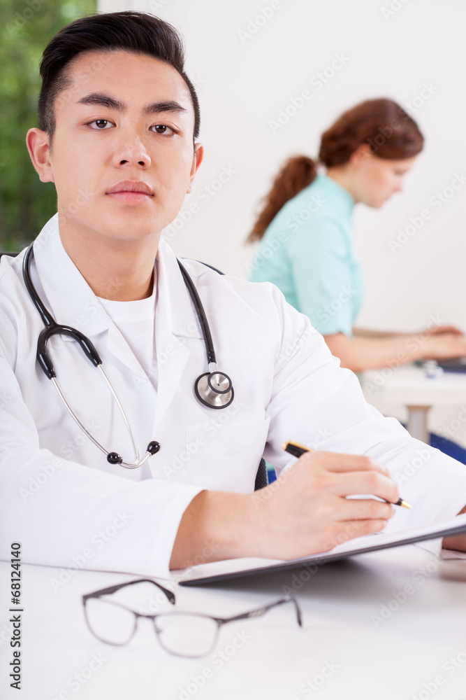 Doctor taking notes Doctor taking notes