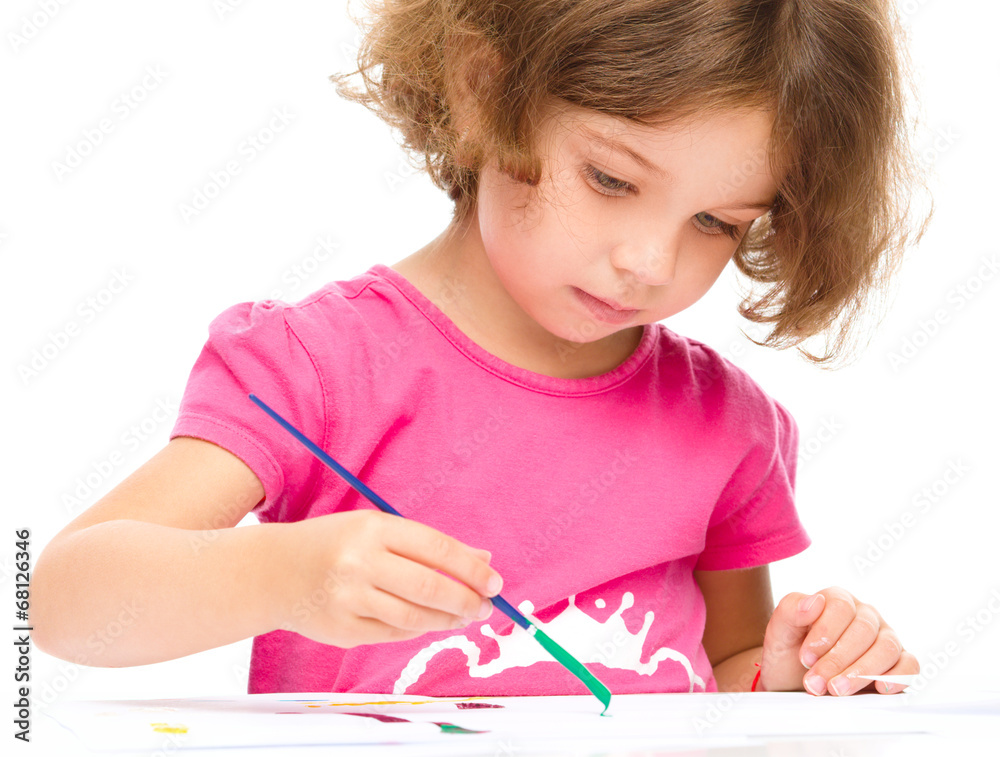Little girl is painting with gouache Little girl is painting with gouache