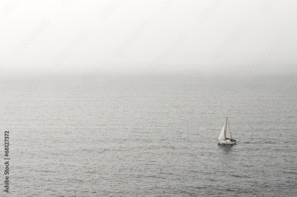 lonely sailboat on water