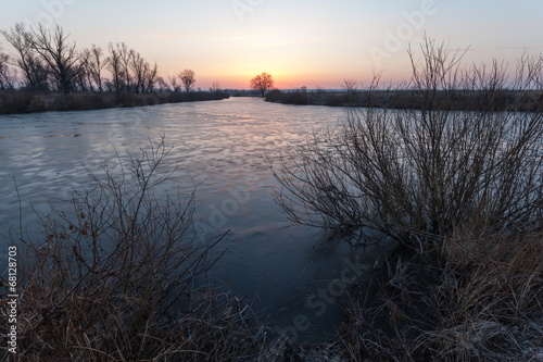 Winter landscape, dawn over the river