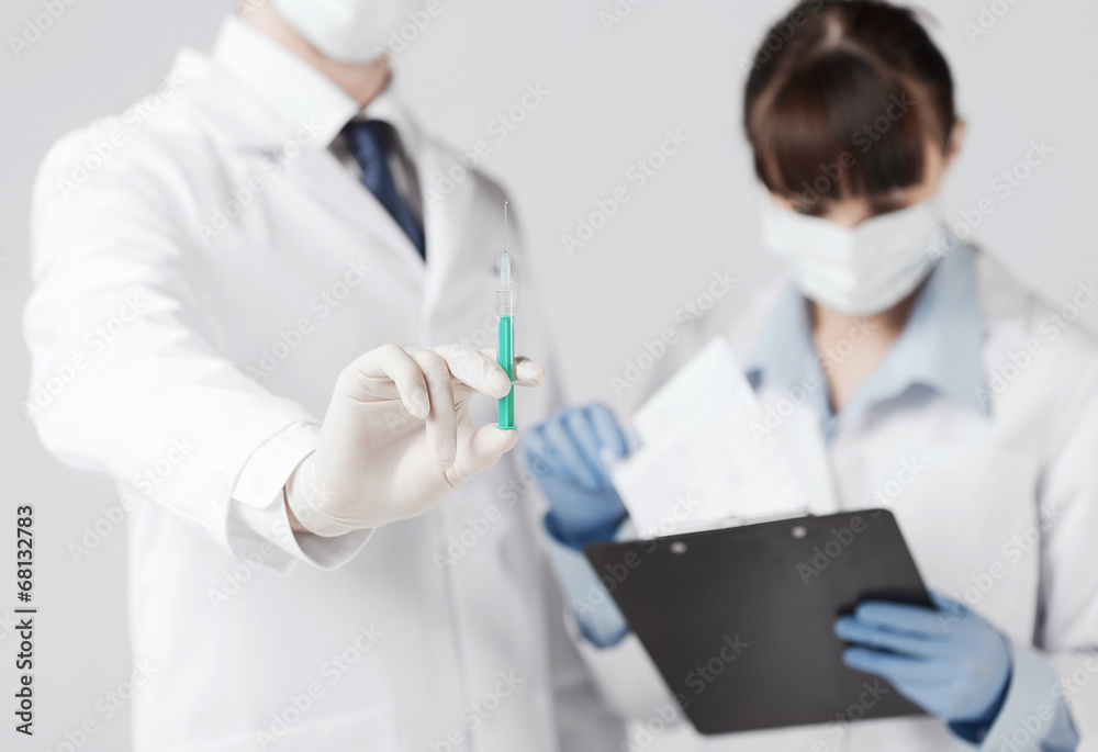 doctors with syringe doctors with syringe