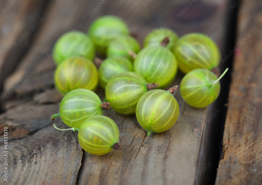 Ripe gooseberries on a wooden Ripe gooseberries on a wooden