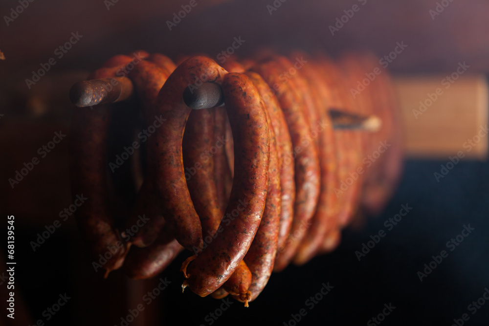 Traditional food. Smoked sausuages in smokehouse. - obrazy, fototapety, plakaty 