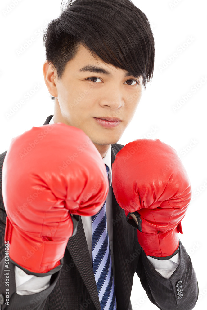 Business man sneer and ready to fight with boxing gloves Business man sneer and ready to fight with boxing gloves