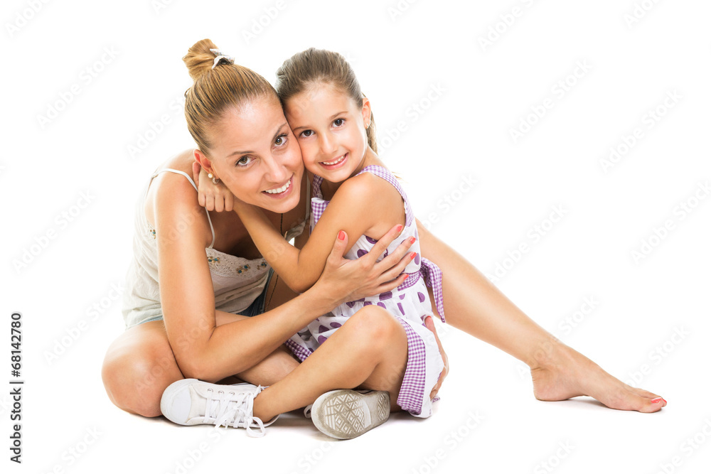Young mother and daugther hugging and smiling Young mother and daugther hugging and smiling