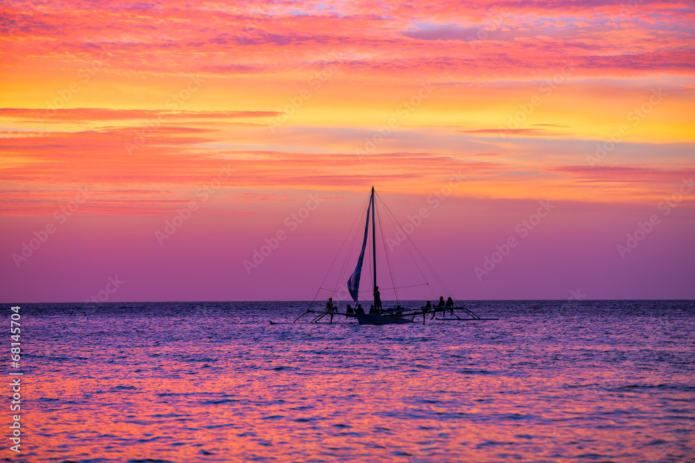 Sailing boat in the beautiful sunset