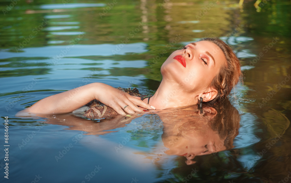 Beautiful woman in the water