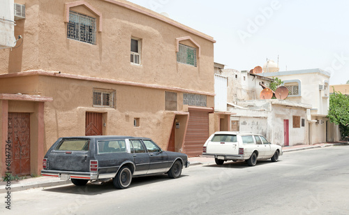 Street view with parked cars, Rahima town, Saudi Arabia © evannovostro
