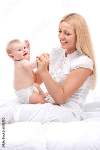 young mum holding small baby.