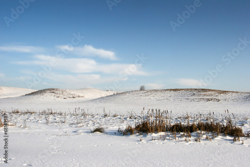 Snowy hills in the winter view field