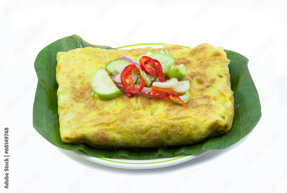 Vietnamese stuffed crispy omelet on banana leaf