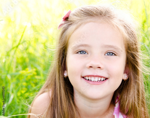 Portrait of adorable smiling little girl