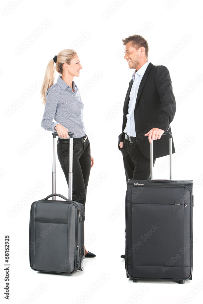 man and woman standing with luggage and talking. man and woman standing with luggage and talking.