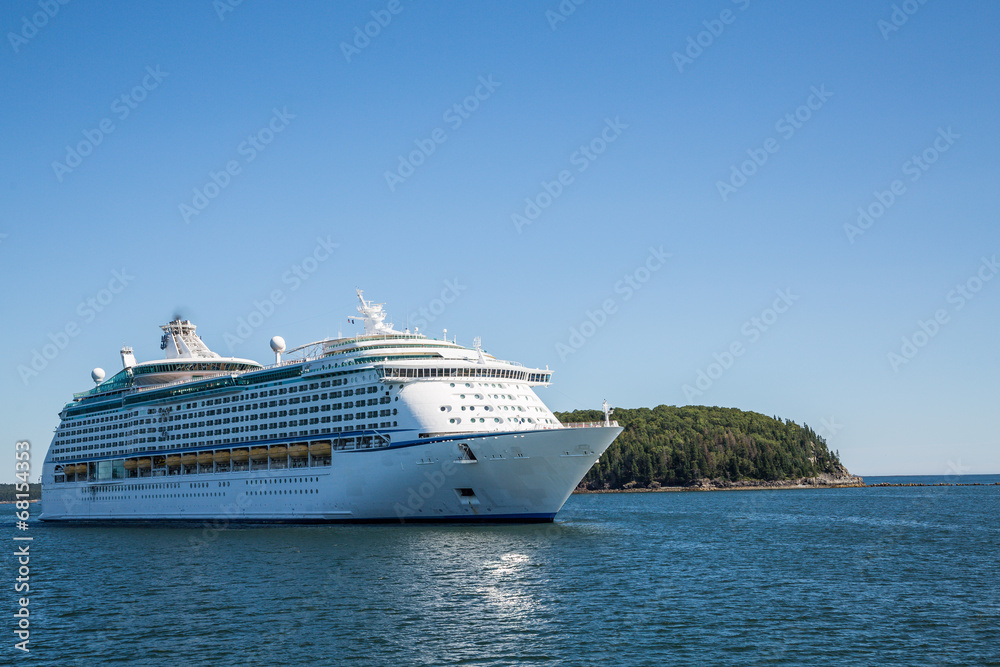 Cruise Ship by Green Island on Blue Water