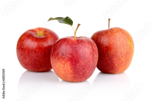 Studio shot of red apples with leaf