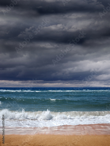 Storm clouds over blue ocean, a storm is coming