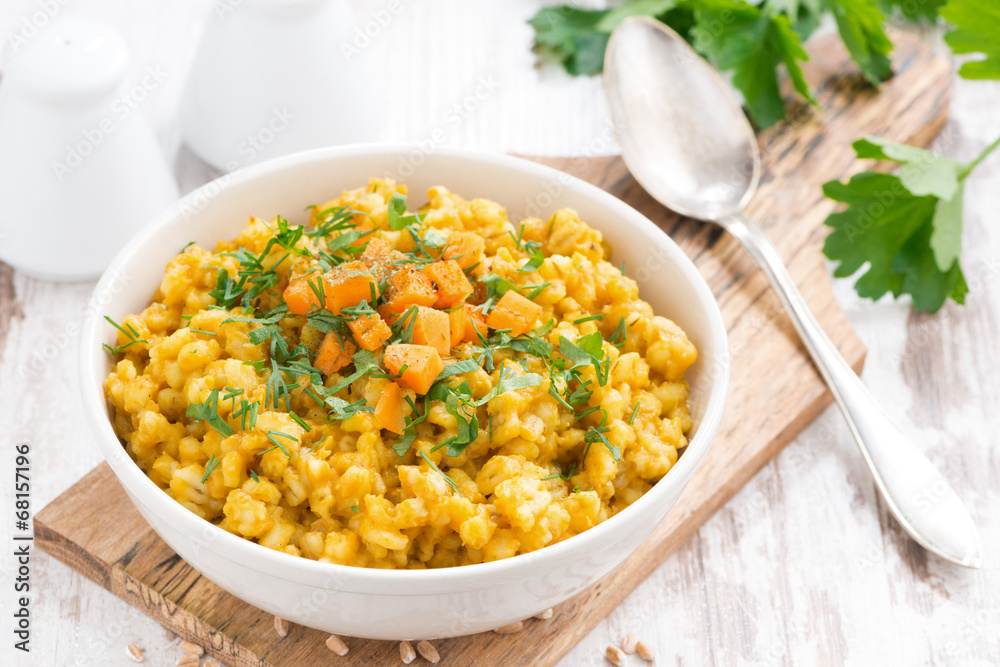 barley porridge with pumpkin and greens in a bowl barley porridge with pumpkin and greens in a bowl