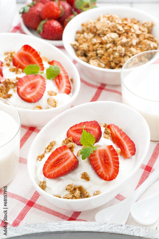 healthy breakfast - yogurt, strawberries, granola and milk healthy breakfast - yogurt, strawberries, granola and milk