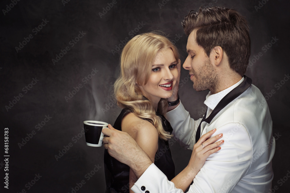 Plakat Young couple drinking coffee in the cafe