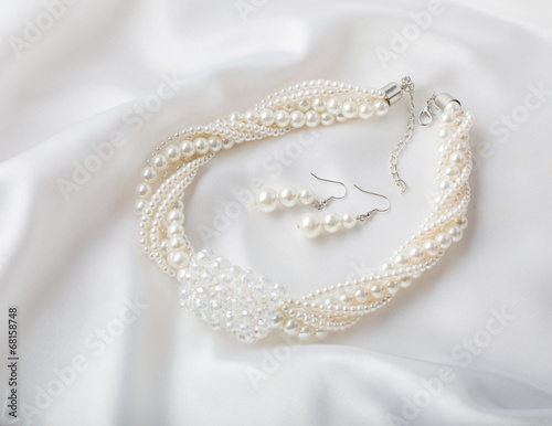 Pearl necklace on white background