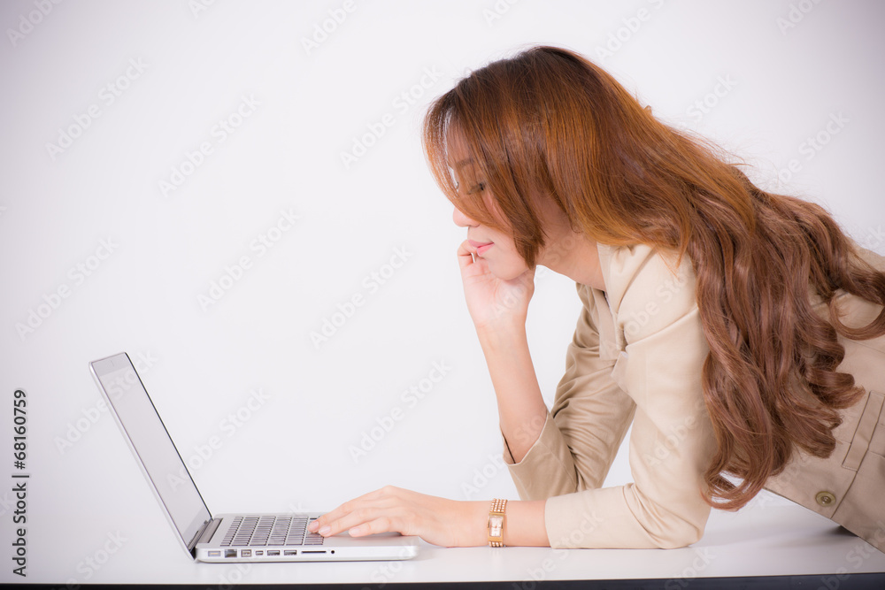 Portrait of a young business woman using laptop at office Portrait of a young business woman using laptop at office