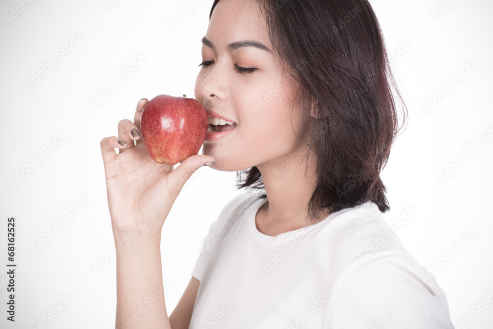 Smiling woman with apple isolated on white Smiling woman with apple isolated on white