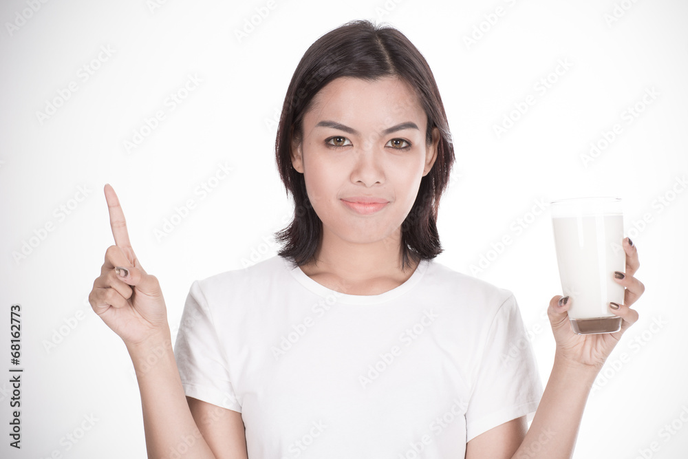 Laughing young woman with a glass of milk Laughing young woman with a glass of milk