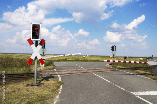 Fotografie Level crossing with barrier closed