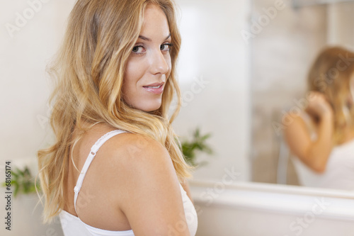 Portrait of beautiful woman in bathroom
