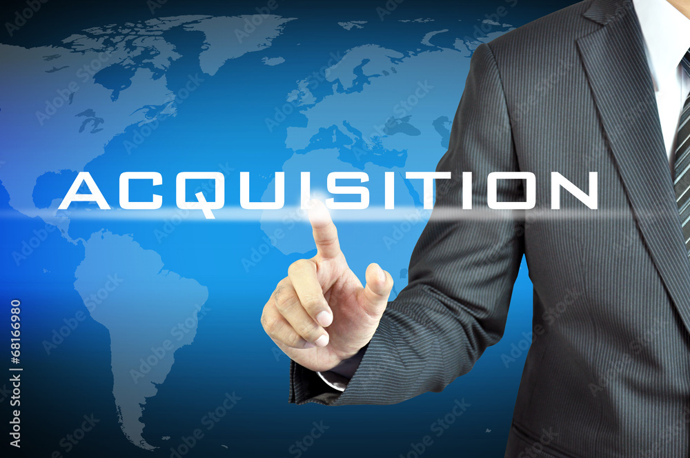 Businessman hand touching ACQUISITION word on virtual screen Businessman hand touching ACQUISITION word on virtual screen