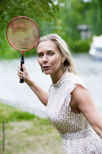 woman playing badminton © wernerimages