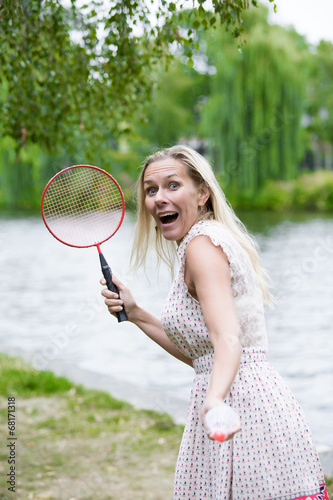 woman playing badminton © wernerimages