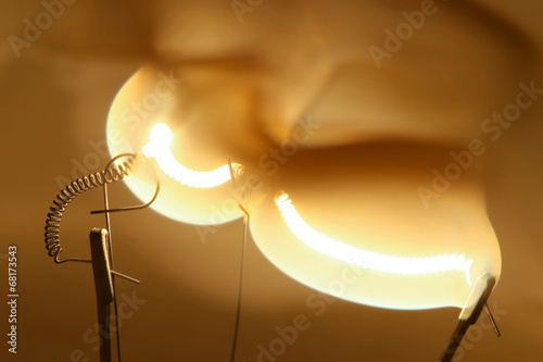 Close up glowing light bulb thread