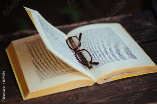 reading a book with glasses