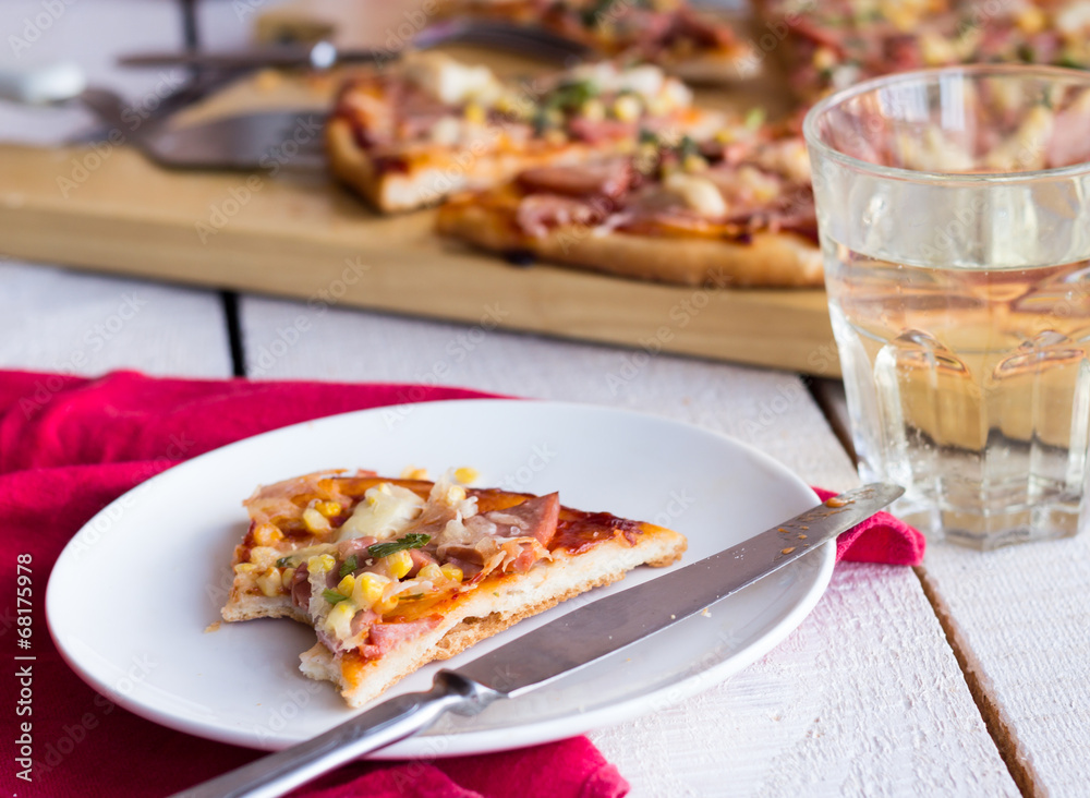 pizza slices on a plate, white table and a glass of soda pizza slices on a plate, white table and a glass of soda