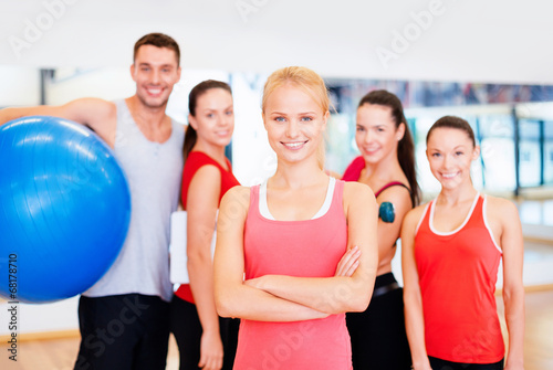 woman standing in front of the group in gym