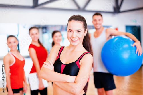 woman standing in front of the group in gym