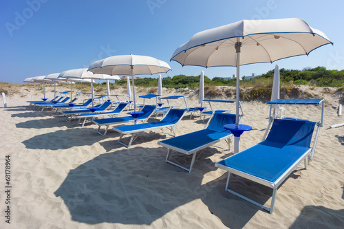 sunbeds and beach ubrellas in Gallipoli  Apulia  Italy