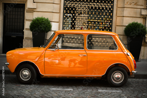 Retro car orange color purity in the street