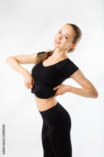 Happy fitness young woman in black sportswear © BestForYou