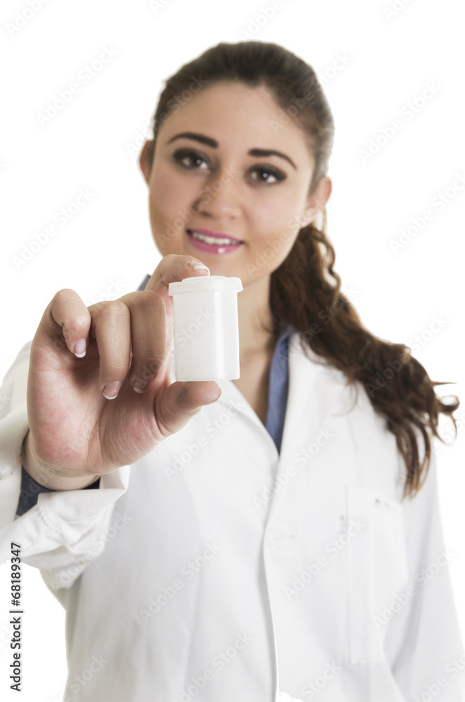 Young beautiful female doctor holding a pill bottle